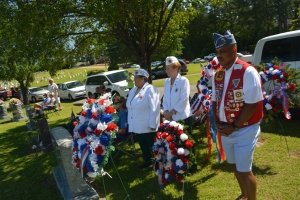 Veterans stand by with wreathes to be laid at the foot of the veterans memorial at Cedarwood today.