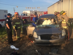 Firefighters attend to the vehicle.
