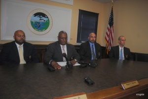 Macon, center, is flanked by his police captain, James Avens, and SBI agents Walter Brown and john Taylor, far right. 