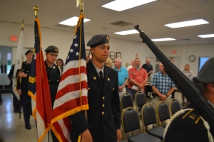 Cadets march in to post colors before the start of the meeting.