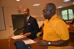 Credle, left, and Sykes, address the board.