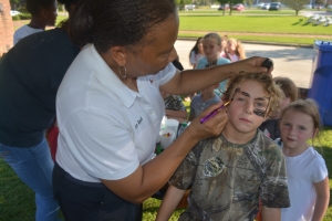 Reed does face-painting at last year&#039;s event.