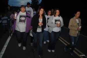Friends and familty march at a vigil in honor of Bell soon after her murder.