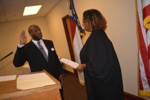 Judge Freeman administers the oath of office to her husband.