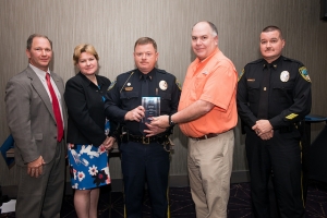 Davis, holding plaque, is pictured with, from left, Don Nail, head of the Governor’s Highway Safety Program; Meg Miller, traffic safety specialist for Region 3 of the National Highway Traffic Safety Association; Bob Stevens of the GHSP; and Tarboro police Chief Jesse Webb.