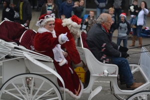Mrs. Claus waves to the crowd during last year&#039;s parade.