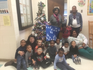Pictured are Eunice Hill, director of Childcare Center; Tomika Mason, family service specialist for HCC; Lakia Joyner, teacher at Childcare Center sitting on right; Karen Connell, of the company&#039;s HR and community relations department, sitting on left; Za’Kwan, Jahzaria, Patrick, Ethan,Ry’Nel,Zilah, Tamera, Marquis, Larry, and Kameron.